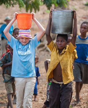 neverseconds-martha-payne-carrying-water-in-malawi.jpg